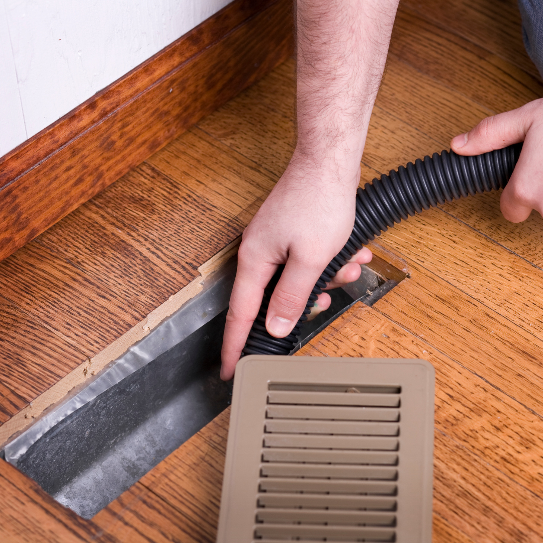 An air vent being cleaned